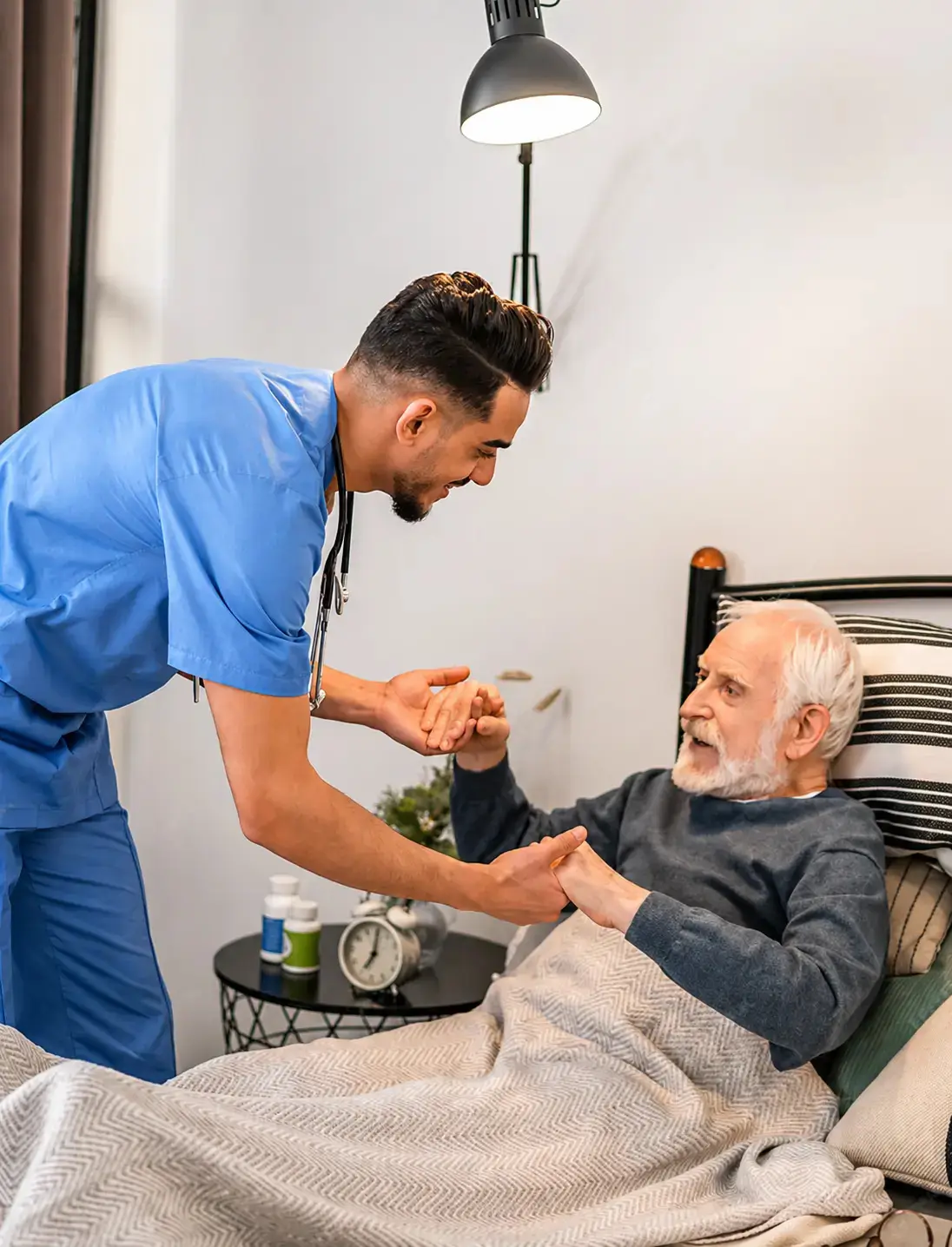 Caregiver taking care of an elderly at his home